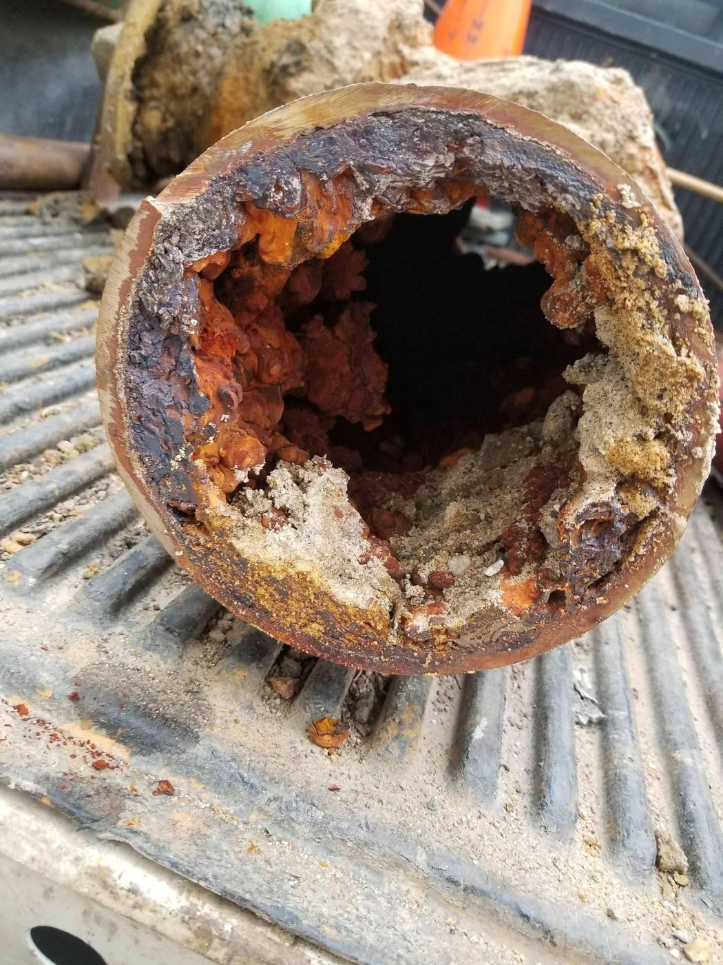Severely corroded interior of an old water pipe